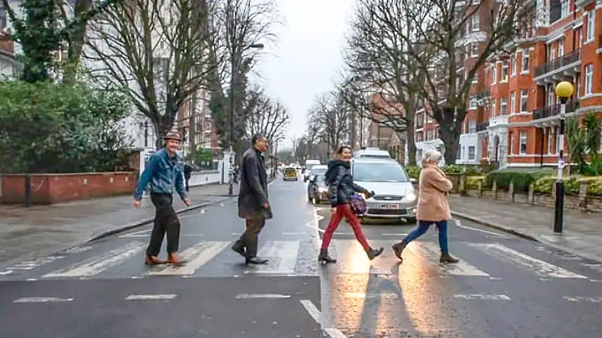 Walking across the Abbey Road zebra crossing