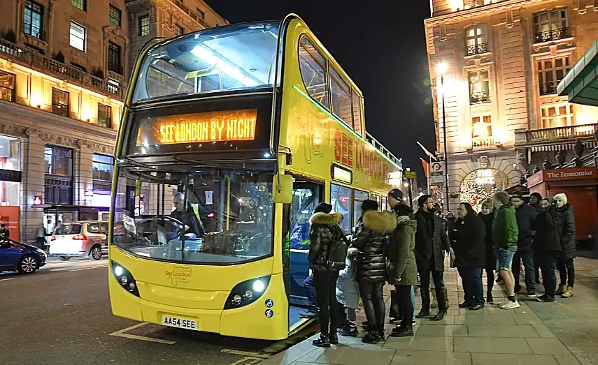 Boarding the bus outside the Ritz Hotel