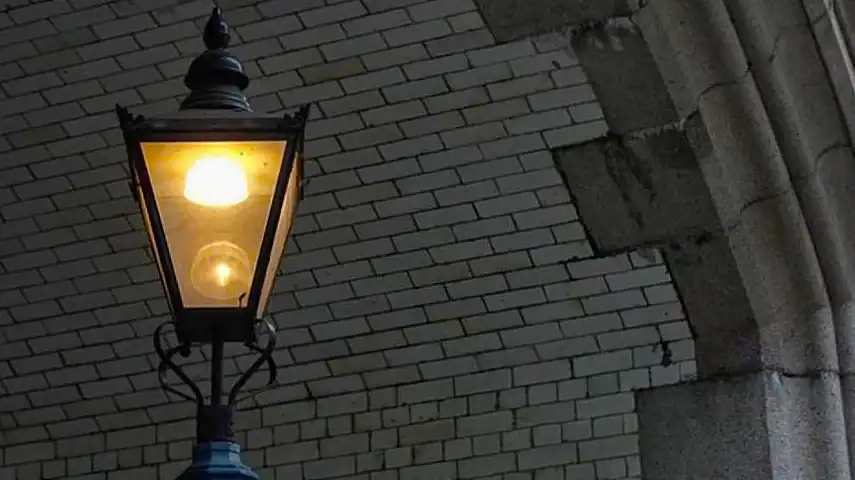 A gas-lit lamp in the East End of London