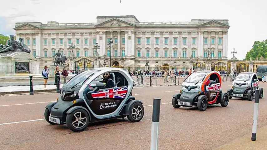 Karts driving past Buckingham Palace