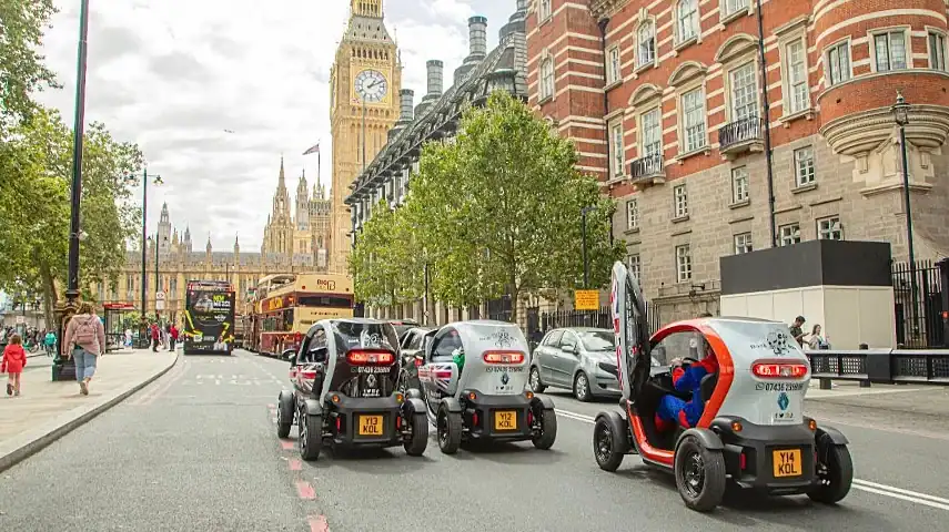 Karts driving towards Big Ben and Parliament