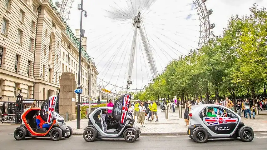 Karts driving past the London Eye