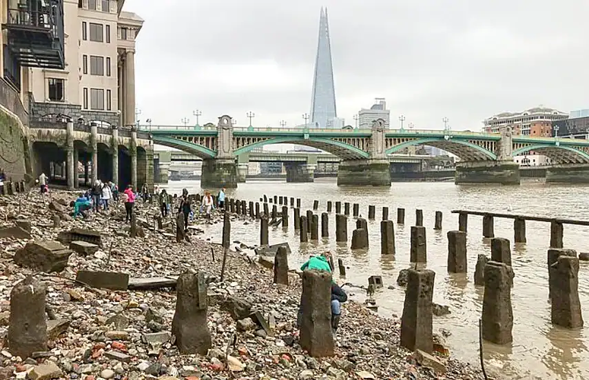 Mudlarking with the Shard in the background