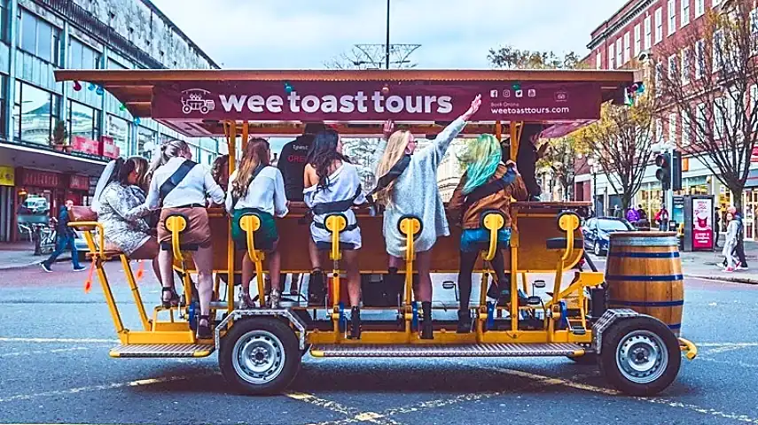 Group enjoying a night out on the Beer Bike Tour