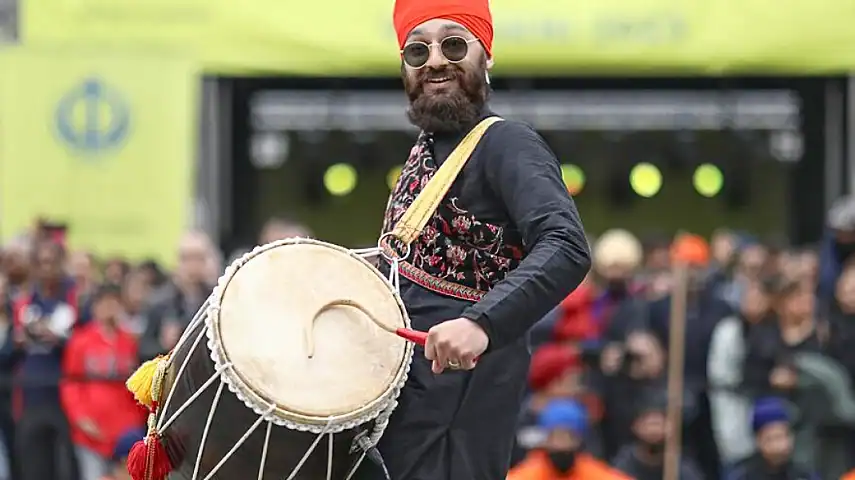A traditional dhol drummer
